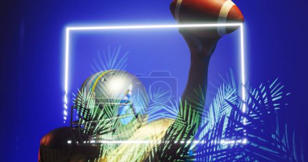 Photo for Composite of american football player raising ball by illuminated rectangle and plants, copy space. Blue, winner, happy, sport, competition, illustration, glowing, nature, shape and abstract concept. - Royalty Free Image