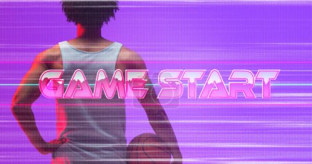 Photo for Composite of game start text with glitch technique over rear view of biracial player with basketball. Copy space, beginning, match, sport, competition, illustration, glowing and abstract concept. - Royalty Free Image