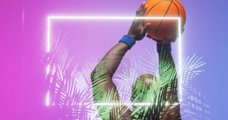 Photo for Bald african american basketball player with arms raised throwing ball by rectangle and plants. Composite, copy space, playing, sport, competition, illustration, illuminated, nature, shape, abstract. - Royalty Free Image