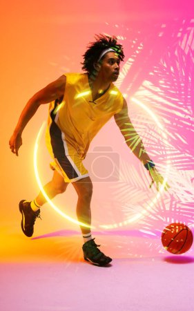 Photo for Composite of biracial basketball player dribbling ball by illuminated plants and circle, copy space. Sport, competition, illustration, glowing, nature and shape concept. - Royalty Free Image