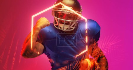 Photo for Cheerful american football player gesturing while standing by illuminated hexagon and plants. Purple, achievement, happy, composite, sport, competition, illustration, glowing, nature, shape, abstract. - Royalty Free Image