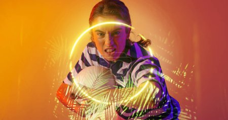 Photo for Composite of caucaisna female player holding ball and clenching teeth over circle and plants. Copy space, illuminated, composite, sport, competition, shape, nature, playing, match and abstract. - Royalty Free Image