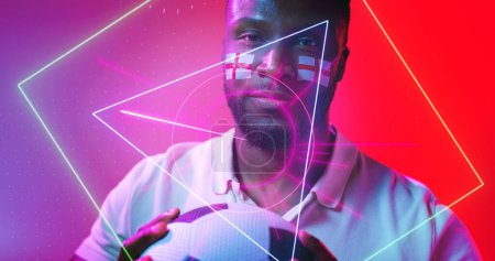 Photo for African american male soccer player with england flag's face paint over illuminated geometric shapes. Ball, composite, sport, portrait, competition, copy space, shape, patriotism and abstract concept. - Royalty Free Image