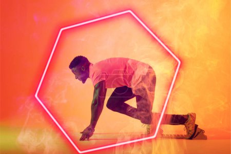 Photo for African american male athlete at starting position by illuminated hexagon over gradient background. Copy space, sprinting, sport, competition, running, racing, smoke, shape and abstract concept. - Royalty Free Image