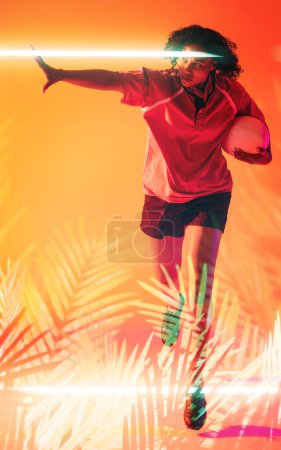 Photo for Illuminated line and plants over biracial female player with rugby ball running on orange background. Copy space, composite, sport, competition, shape, nature, playing, match and abstract concept. - Royalty Free Image