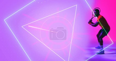 Photo for Side view of african american tennis player holding racket by illuminated multiple geometric shapes. Copy space, composite, sport, competition, playing, match, shape and abstract concept. - Royalty Free Image