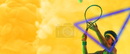 Photo for African american female player hitting ball with racket by illuminated triangle on smoky background. Copy space, tennis, composite, sport, competition, shape, playing, match and abstract concept. - Royalty Free Image