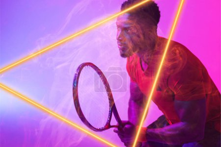 Photo for African american male tennis player with racket by illuminated triangle on gradient background. Copy space, serious, composite, sport, competition, shape, playing, match and abstract concept. - Royalty Free Image