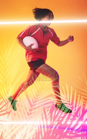 Photo for Biracial female rugby player holding ball and jumping over illuminated line and plants. Copy space, composite, sport, competition, shape, nature, playing, match and abstract concept. - Royalty Free Image