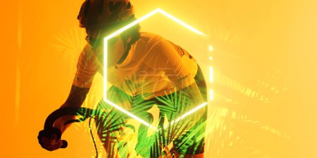 Téléchargez les photos : African american female athlete riding bike by illuminated hexagon and plants on yellow background. Copy space, composite, sport, cycling, racing, competition, nature, shape and abstract concept. - en image libre de droit