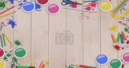 Téléchargez les photos : Composition of paints and crayons with copy space on wooden boards. Children's art week and fun concept digitally generated image. - en image libre de droit