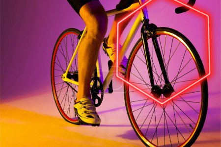 Photo for Illuminated hexagon over low section of caucasian male athlete riding bike on purple background. Copy space, composite, sport, cycling, racing, competition, leg, shoe, shape and abstract concept. - Royalty Free Image