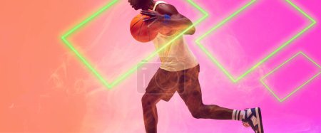Téléchargez les photos : Low section of african american basketball player running and dribbling ball by rectangles. Copy space, smoke, composite, illuminated, sport, competition, illustration, shape and abstract concept. - en image libre de droit