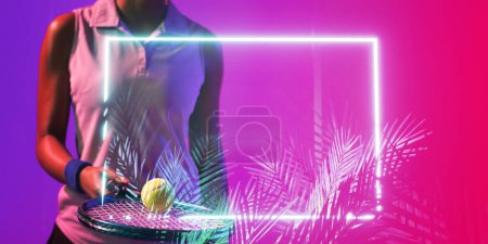 Téléchargez les photos : Midsection of african american female player with tennis racket and ball over plants and rectangle. Copy space, composite, sport, competition, shape, playing, nature, pink, match, hand, illuminated. - en image libre de droit