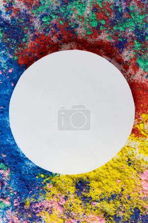 Téléchargez les photos : Close up of multi coloured powder with white circle and copy space. Holi festival, colour, hindu tradition and celebration concept. - en image libre de droit