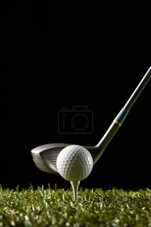 Photo for White golf ball on golf tee and golf club on grass with copy space. Golf, sports and competition concept. - Royalty Free Image