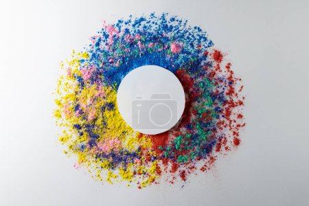 Photo for Close up of multi coloured powder with white circle and copy space on white background. Holi festival, colour, hindu tradition and celebration concept. - Royalty Free Image