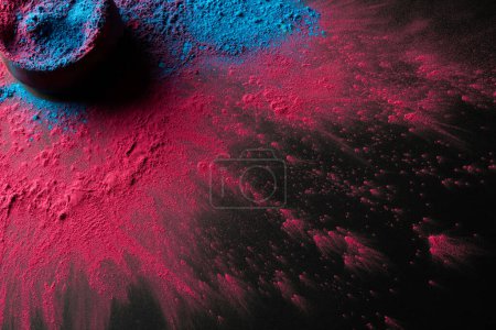 Photo for High angle view of multi coloured powder and bowl with copy space on black background. Holi festival, colour, hindu tradition and celebration concept. - Royalty Free Image