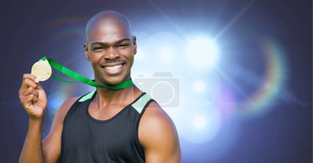 Photo for Portrait of african american man holding medal around his neck against bright light spots. sports tournament and competition concept - Royalty Free Image