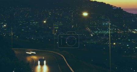 Photo for Landscape with cars on road and city on mountains at sunset. Scenery, city and travel concept. - Royalty Free Image