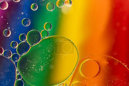 Photo for Macro close up of water bubbles with copy space on rainbow background. Macro, colour, water, shape and pattern concept. - Royalty Free Image