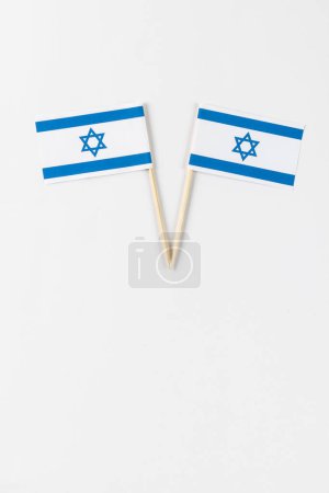 Photo for Close up of two flags of israel with copy space on white background. Jewish religion and tradition. - Royalty Free Image