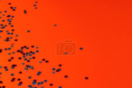 Photo for Red, blue and white stars of flag of united states of america with copy space on orange background. American patriotism, independence day and tradition concept. - Royalty Free Image