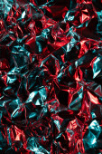 Close up of crumpled shiny blue and red foil with copy space. Colour, texture and material. Poster #649371566