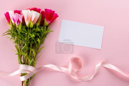 Photo for Image of pink and white flowers with ribbon and card with copy space on pink background. Mothers day, nature and spring concept. - Royalty Free Image
