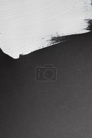 Photo for Close up of white paint stripe on black background with copy space. Abstract background, pattern and colour. - Royalty Free Image