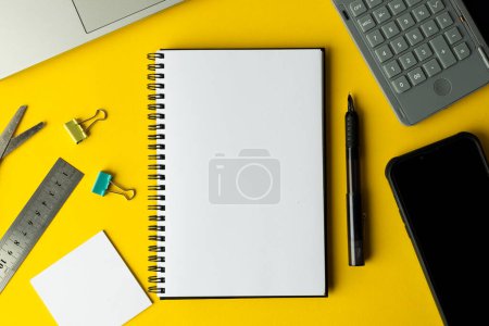 Photo for Flat lay of notebook with copy space and school materials on yellow background. School materials, writing, colouring, drawing, learning, school and education concept. - Royalty Free Image