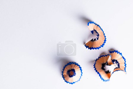 Photo for Close up of blue pencil shavings with copy space on white background. School materials, writing, drawing, learning, school and education concept. - Royalty Free Image