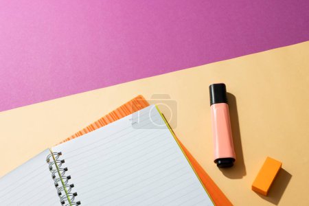 Photo for Flat lay of notebooks and highlighter with copy space on pink and yellow background. School materials, writing, colouring, drawing, learning, school and education concept. - Royalty Free Image