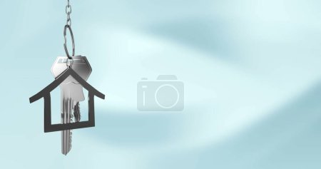 Photo for Composition o silver key and house key fob and copy space on blue background. Home ownership and property concept digitally generated image. - Royalty Free Image