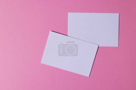 Photo for White business cards with copy space on pink background. Business, business card, stationery and writing space concept. - Royalty Free Image