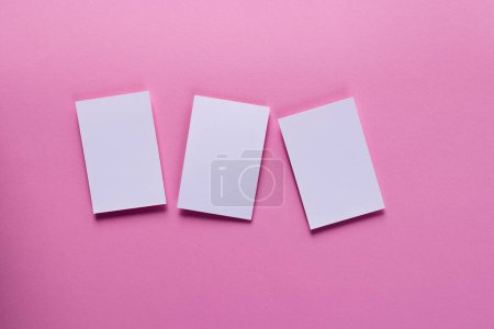 Photo for White business cards with copy space on pink background. Business, business card, stationery and writing space concept. - Royalty Free Image