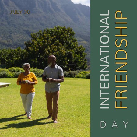 Photo for International friendship day text with happy diverse senior friends walking in sunny garden. Celebration of friendship, appreciation campaign digitally generated image. - Royalty Free Image