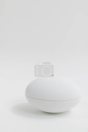 Téléchargez les photos : White rugby ball with copy space on white background. Rugby, sport, international, competition and games digitally generated image. - en image libre de droit
