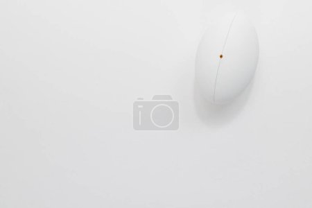 Téléchargez les photos : White rugby ball with copy space on white background. Rugby, sport, international, competition and games digitally generated image. - en image libre de droit