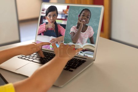 Photo for Cropped hands of diverse child typing on laptop and discussing homework with friends over video call. Unaltered, friends, childhood, technology, education, student, e-learning and home concept. - Royalty Free Image