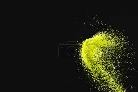 Photo for Close up of yellow sand thrown in the air and copy space on black background. Time, timekeeping, shape and colour concept. - Royalty Free Image
