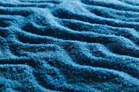Photo for Close up of pattern of blue sand and copy space background. Sand, texture, movement, shape and colour concept. - Royalty Free Image