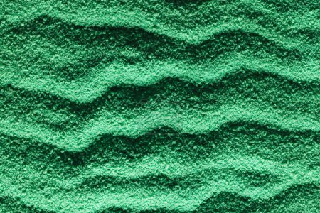 Photo for Close up of pattern of green sand and copy space background. Sand, texture, movement, shape and colour concept. - Royalty Free Image