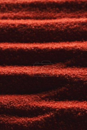 Photo for Close up of pattern of red sand and copy space background. Sand, texture, movement, shape and colour concept. - Royalty Free Image