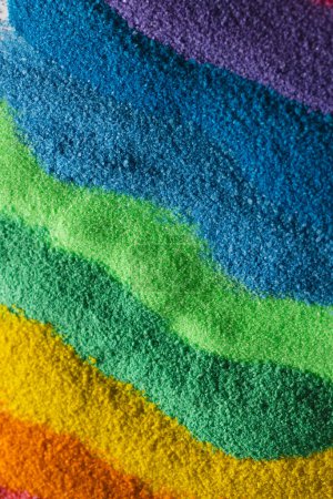 Photo for Close up of stripes of rainbow coloured sand and copy space background. Sand, texture, movement, shape and colour concept. - Royalty Free Image