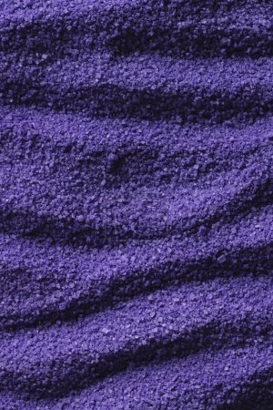 Photo for Close up of pattern of purple sand and copy space background. Sand, texture, movement, shape and colour concept. - Royalty Free Image