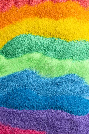 Photo for Close up of stripes of rainbow coloured sand and copy space background. Sand, texture, movement, shape and colour concept. - Royalty Free Image