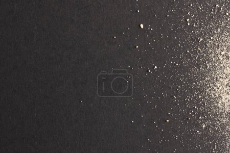 Photo for Close up of sand and copy space on black background. Sand, texture, movement, shape and colour concept. - Royalty Free Image