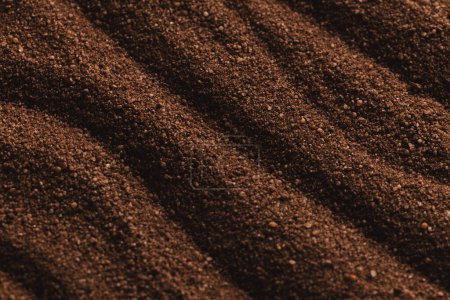 Photo for Close up of pattern of brown sand and copy space background. Sand, texture, movement, shape and colour concept. - Royalty Free Image