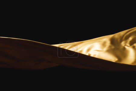 Foto de Primer plano de tela de seda brillante dorado con espacio para copiar sobre fondo negro. Textura, tela, tela, color y material. - Imagen libre de derechos